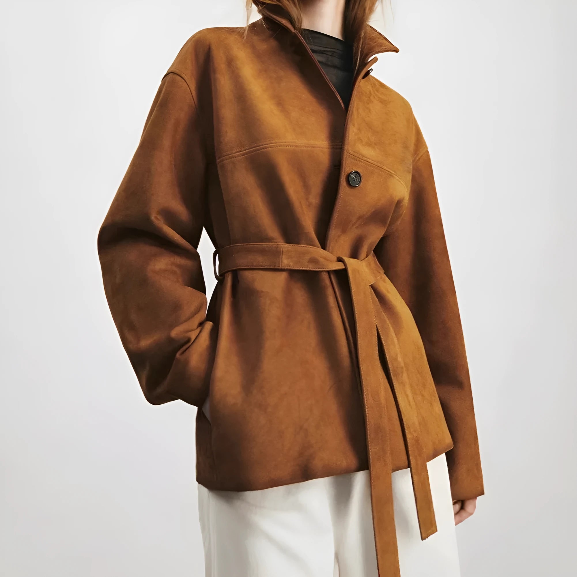 Women's Caramel Mocha cashmere coat with Peter Pan collar and leather stitching in a loose retro fit.