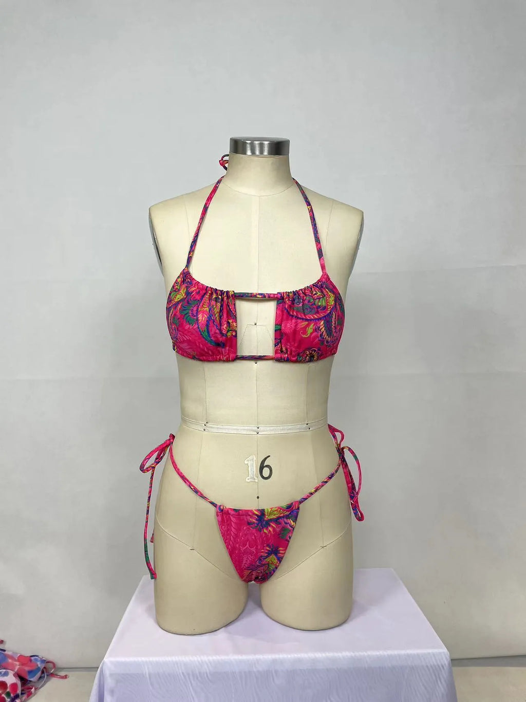 Pink printed women's bikini two-piece set with sleeveless design for swimming and water activities