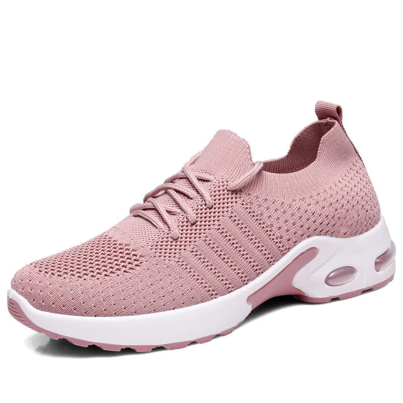 Women's black mesh lace-up sneakers with a round toe and non-slip sole on a white background.