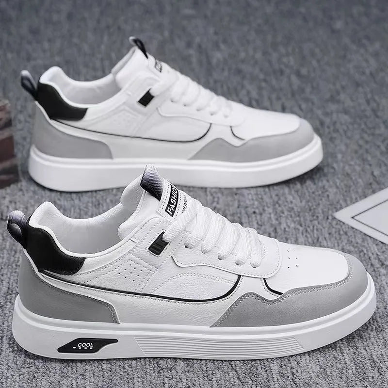 Men's solid colour canvas board shoes with leather stitching and a low-top design.