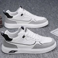 Men's solid colour canvas board shoes with leather stitching and a low-top design.