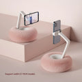 Adjustable rotating bracket holding a tablet, showing vertical extension rod and fabric-covered base.