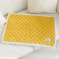 Quilted cloth pet blanket for cats in blue, shown on a cat bed, with size options M, L, and XL.
