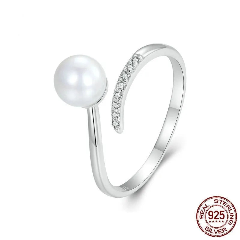 Adjustable S925 sterling silver ring with shell pearl centrepiece and open loop design