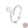 Adjustable S925 sterling silver ring with shell pearl centrepiece and open loop design