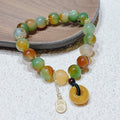 Yellow peacock agate women's bracelet with peace buckle closure measuring 1cm wide