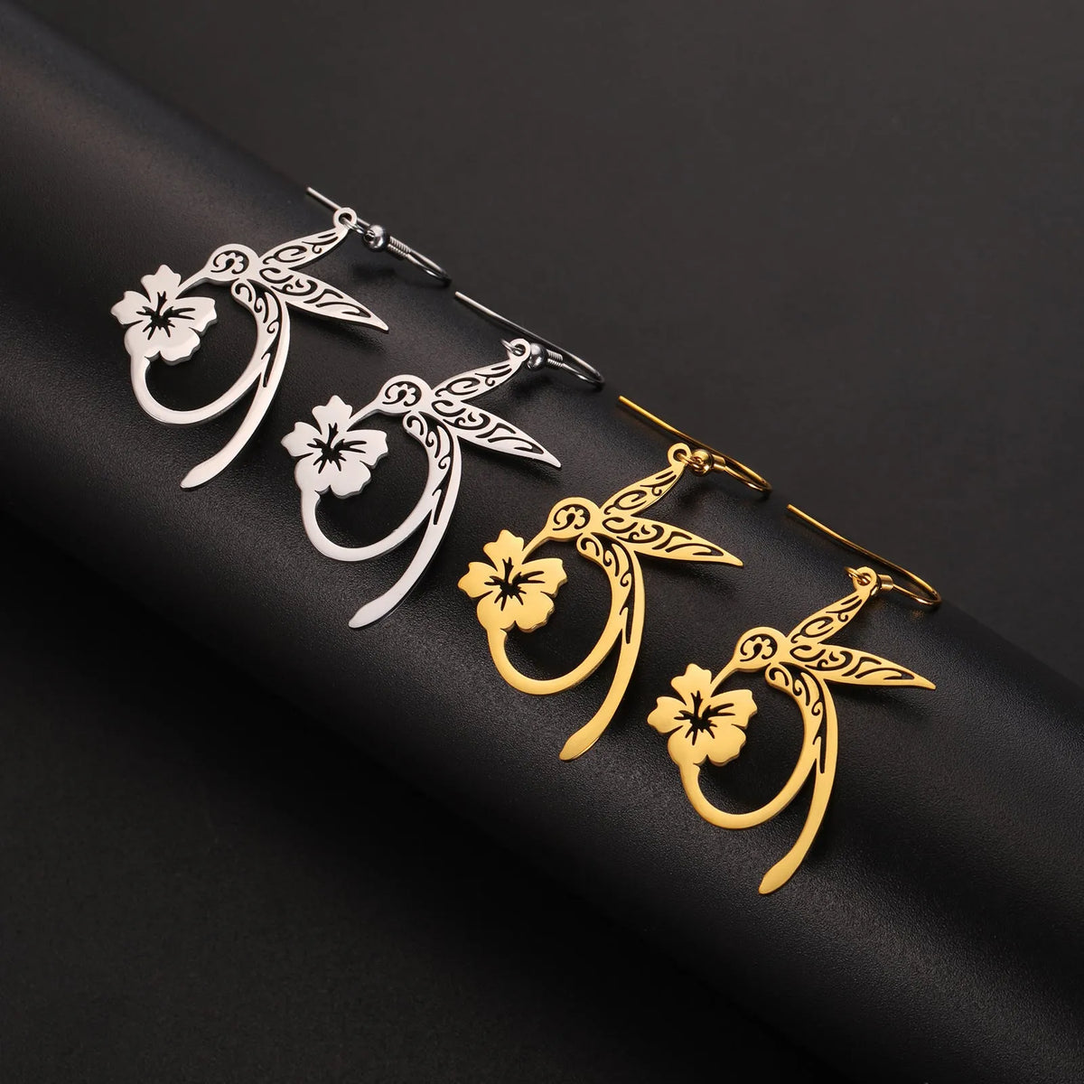 Pair of stainless steel hummingbird earrings with hollow openwork design, available in gold or steel colour