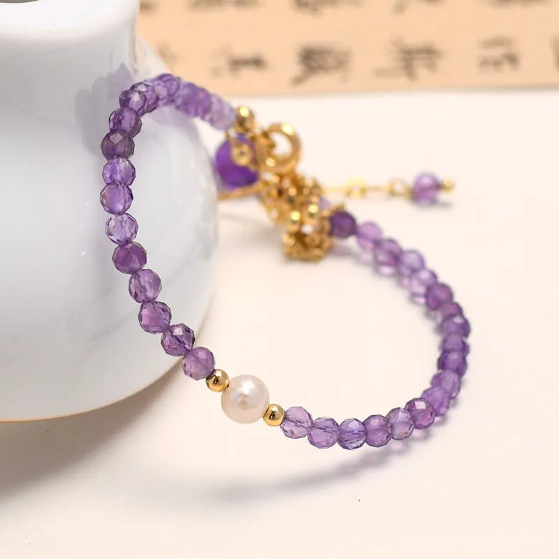 Chinese-style women's bracelet featuring genuine crystal and pearl beads with amethyst purple electroplated finish