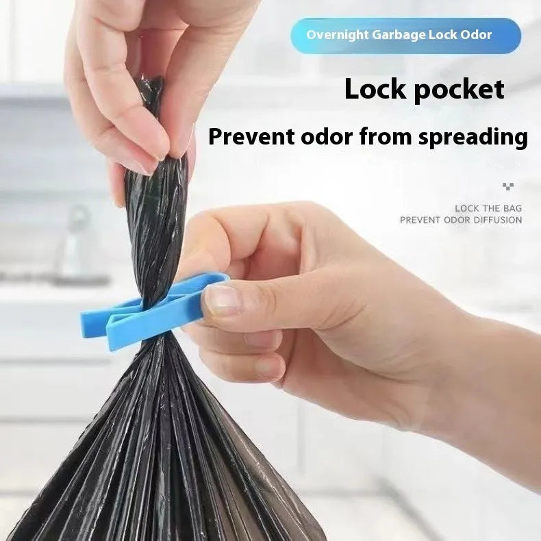 White PP plastic non-slip clip for fixing a bin liner to the side of a kitchen rubbish bin.