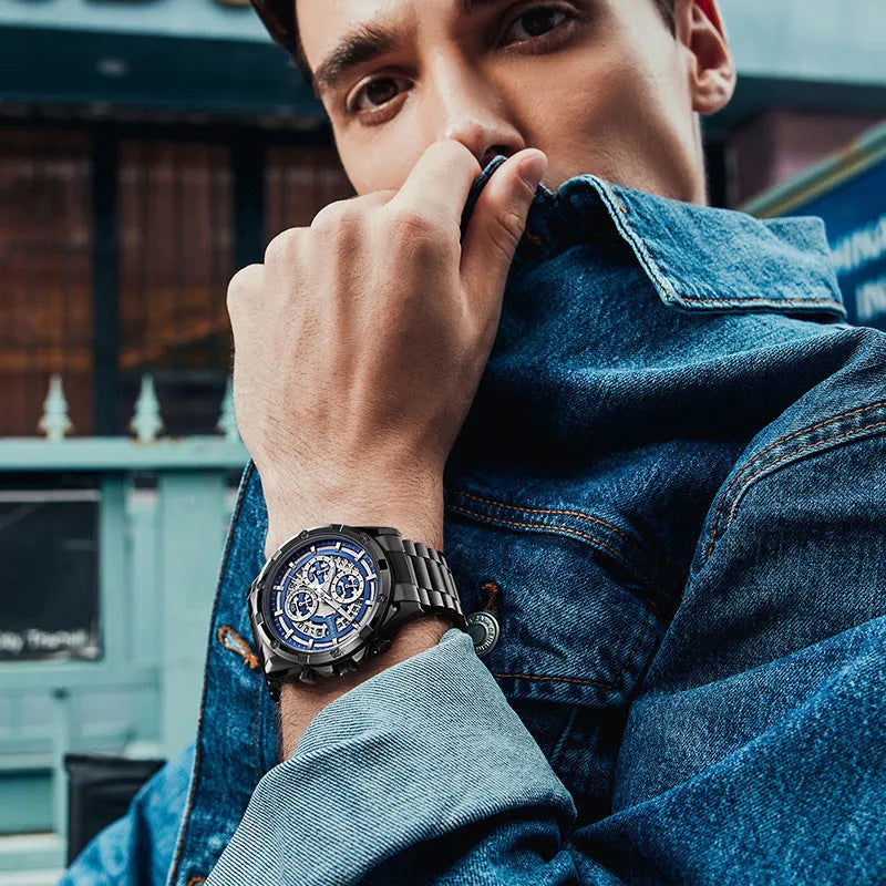 Men's stainless steel luminous quartz watch with a blue dial on a steel bracelet.