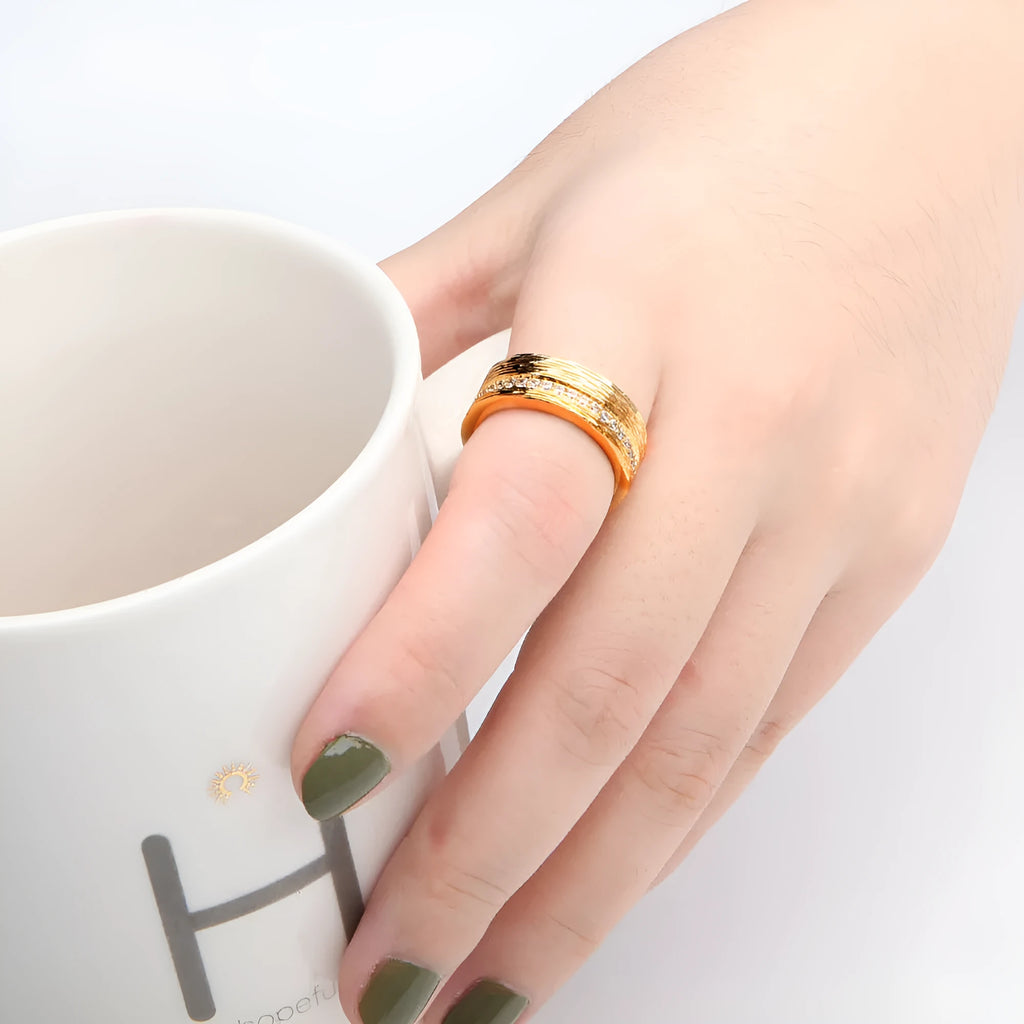 Gold geometric women's zircon ring in electroplated copper, shown in sizes 6-8