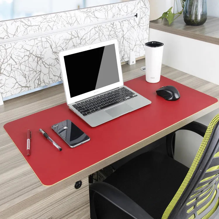 Oversized double-sided PU mouse table mat in sapphire blue and yellow on a desk