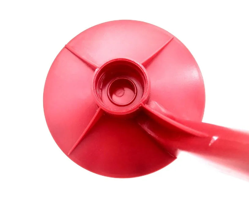 Red plastic Magic Tap soda drink dispenser attached to an inverted 2-litre bottle