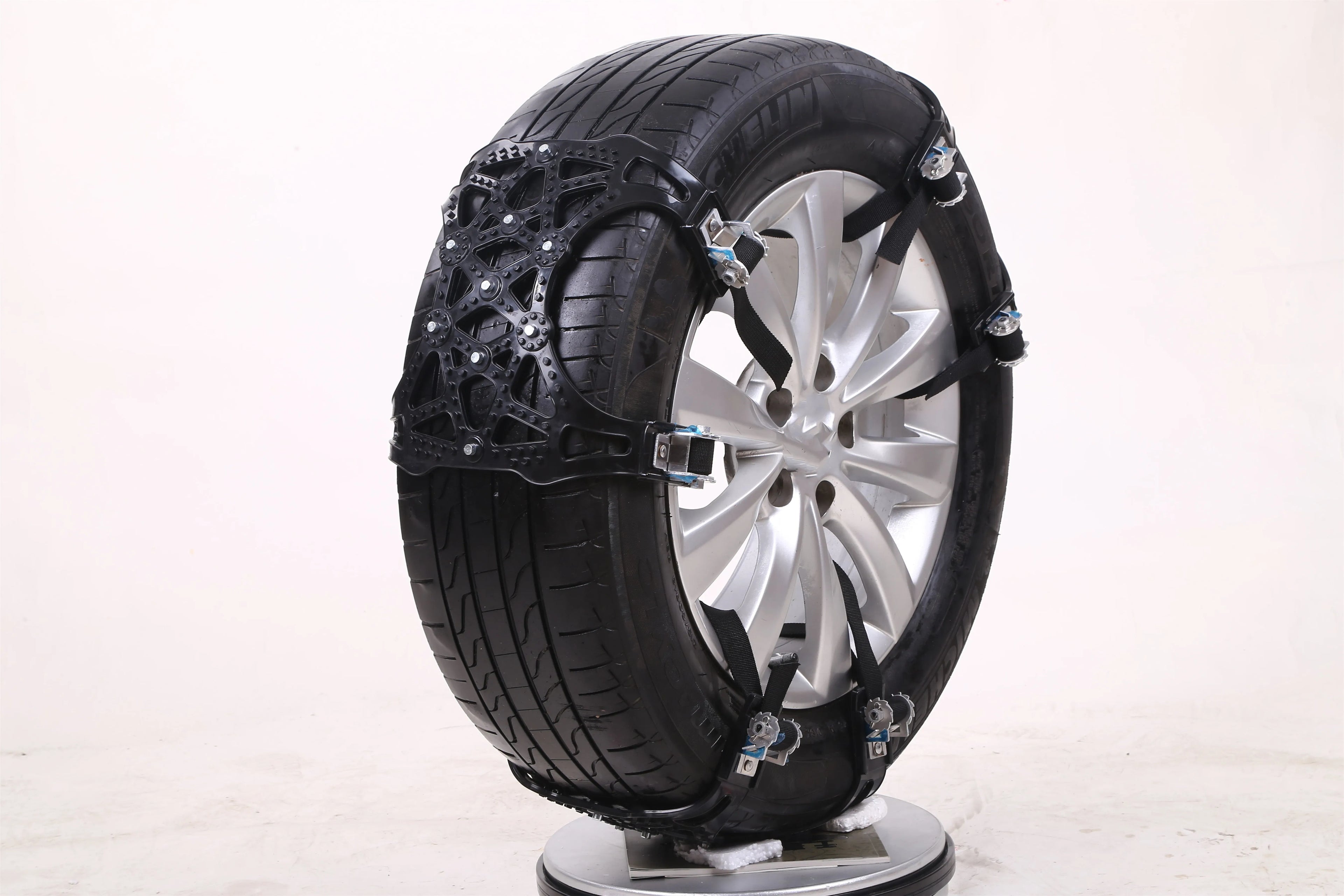 Yellow universal snow chain made from widened thickened TPU with steel nails for non-slip winter traction