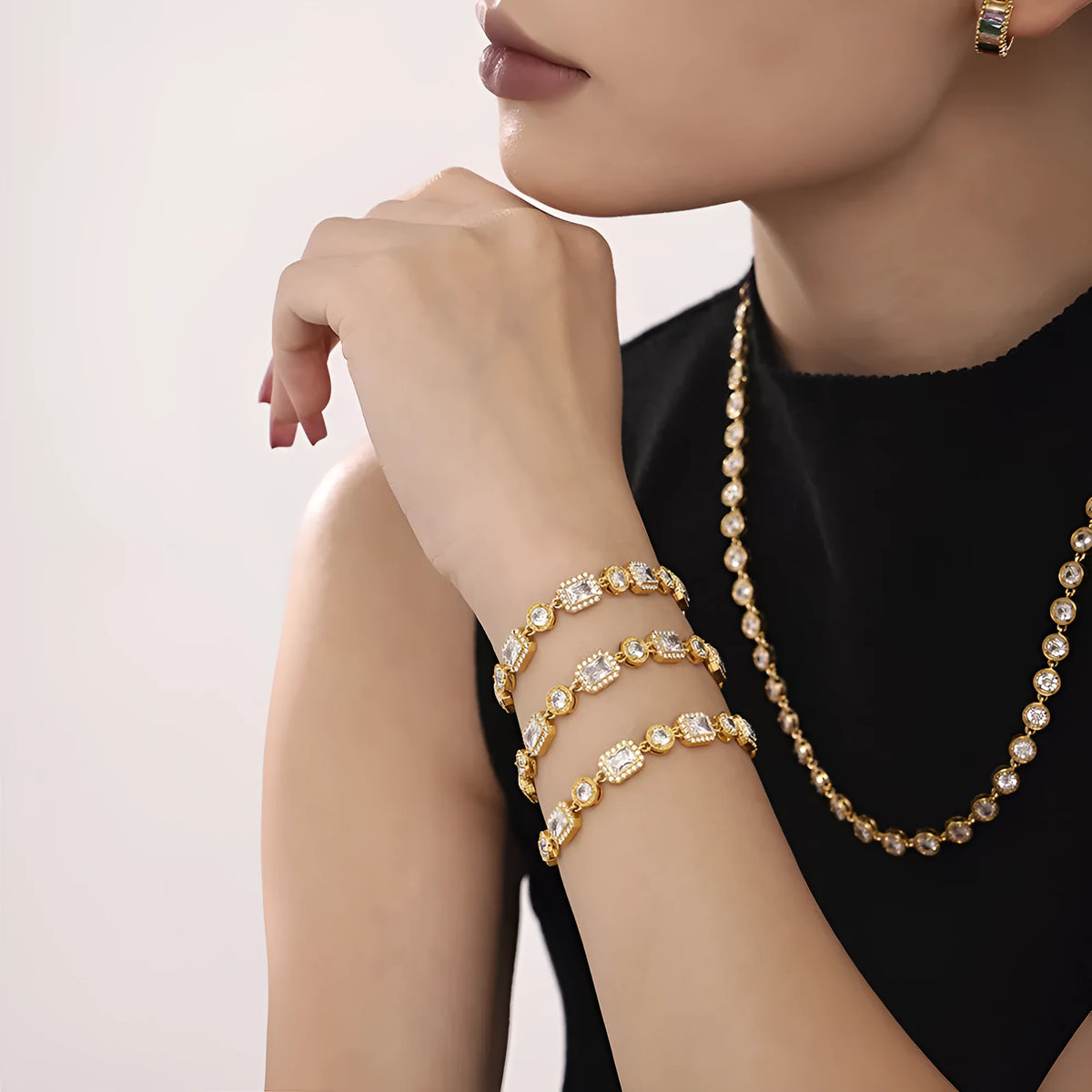 Titanium steel unisex bracelet with square zircon rhinestone inlay, geometric design, gold or steel colour.