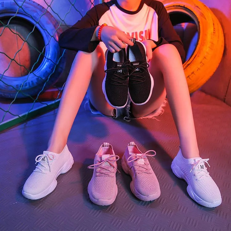 White thick-soled women's casual shoes with woven upper and front strap.