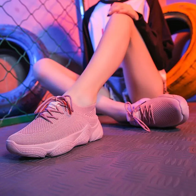 White thick-soled women's casual shoes with woven upper and front strap.