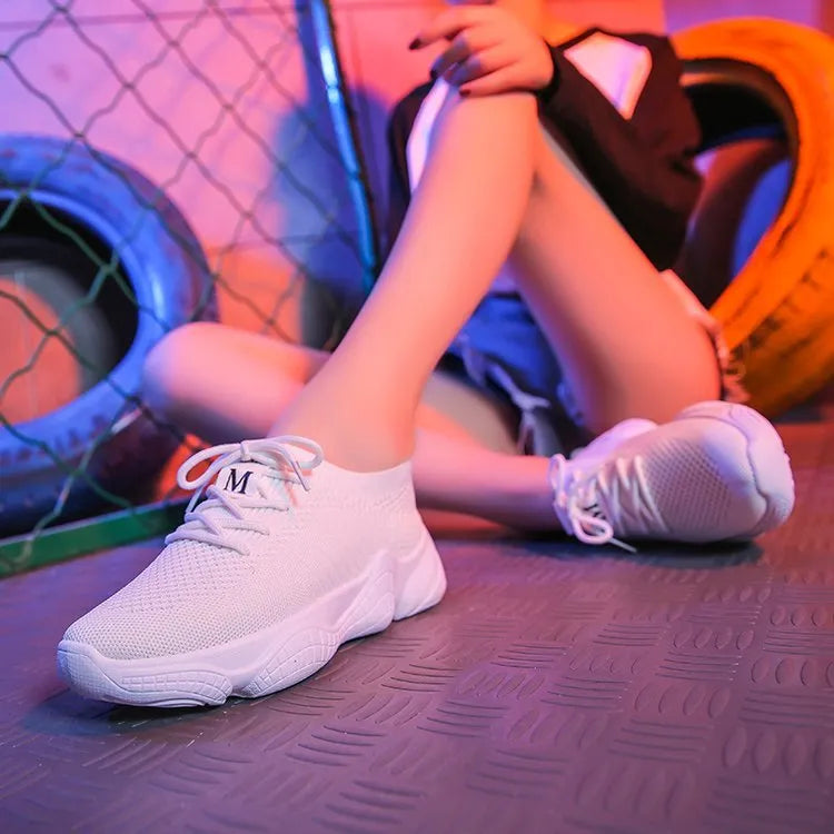 White thick-soled women's casual shoes with woven upper and front strap.