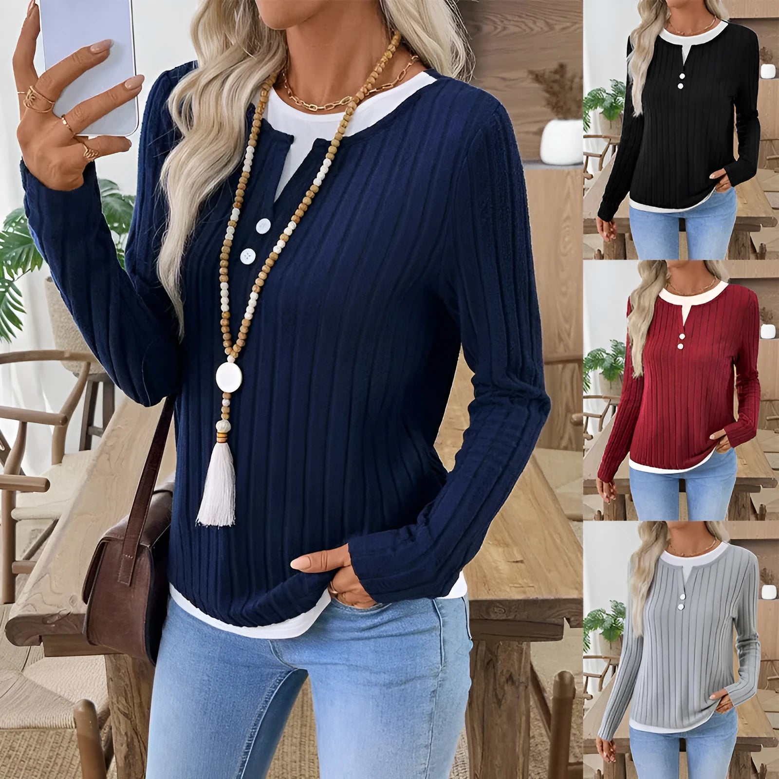 Women's black fake two-piece pullover sweater with round neck button and long sleeves on a model.