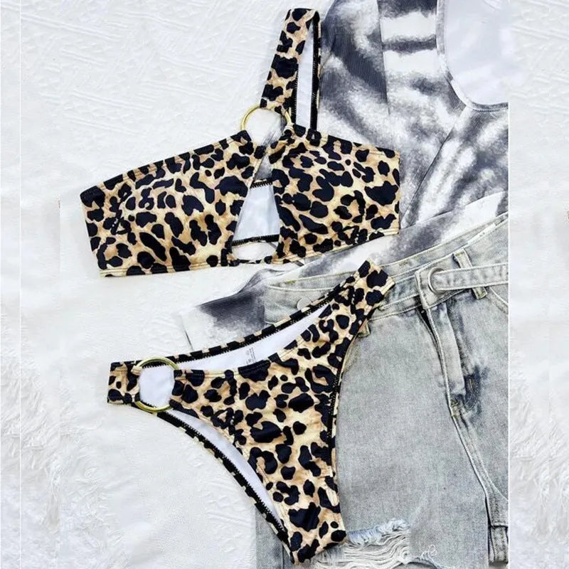 Women's leopard print bikini set with separate top and shorts on a mannequin