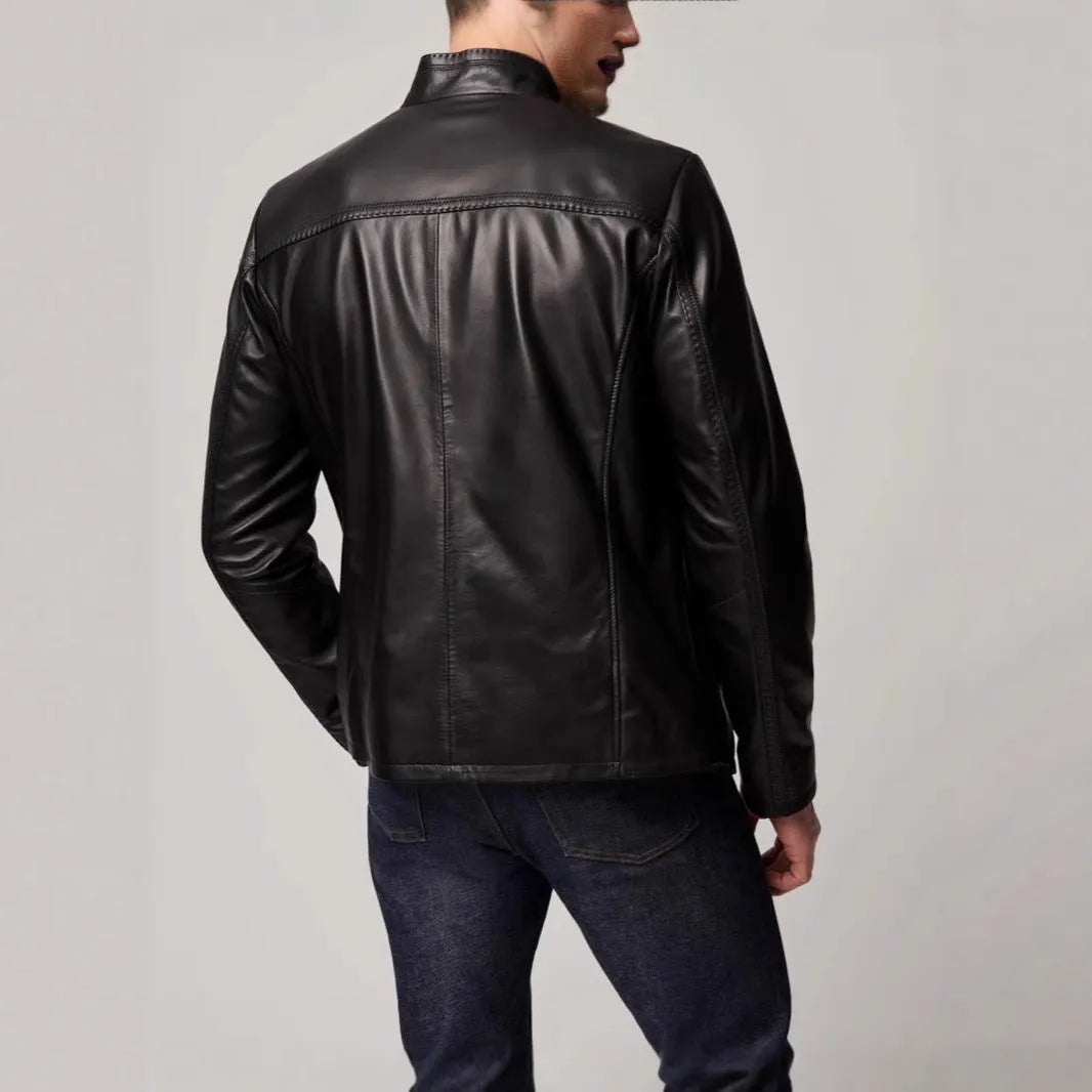 Man wearing a black retro-style leather-look jacket made from polyester fibre.