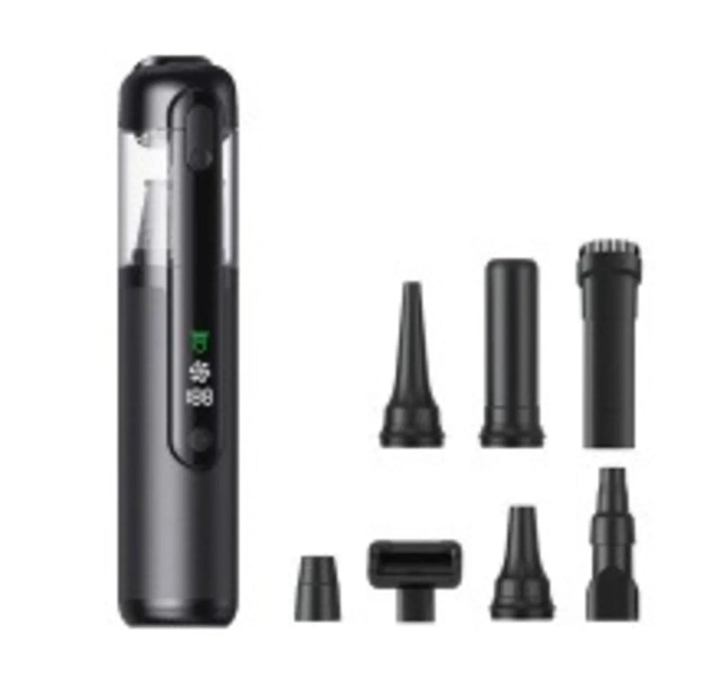 Black handheld car vacuum cleaner with green light dust detection on a car seat