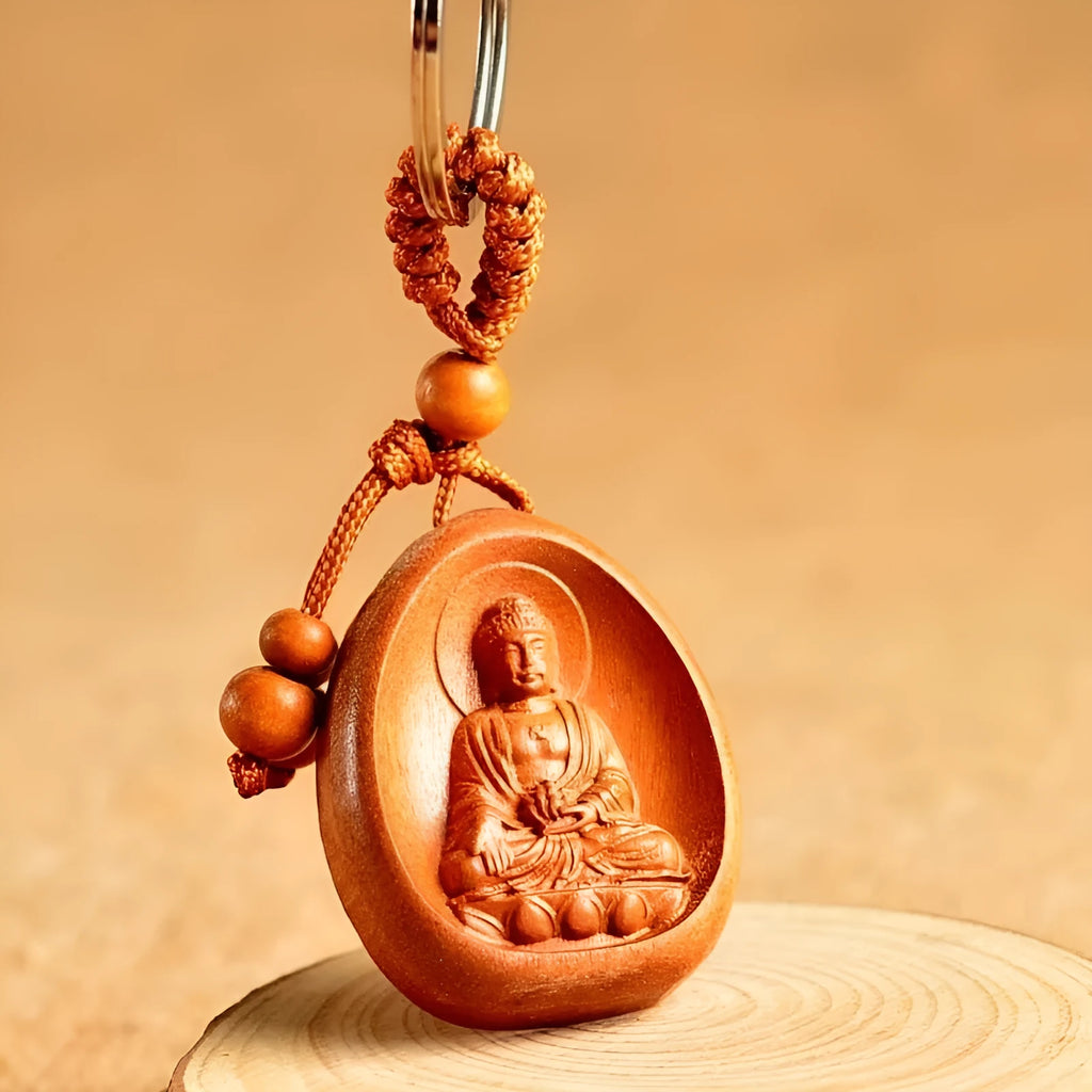 Eight patron saint keychains made of natural Taomu wood in orange colour, each measuring 10x3.2x4cm
