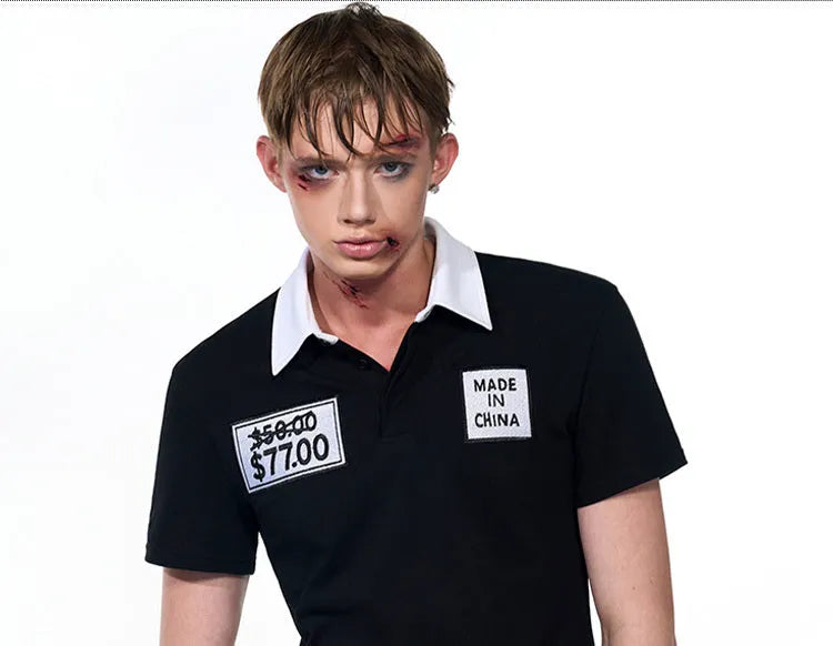 Black slim fit men's short sleeve polo shirt with embroidery detail on the front.