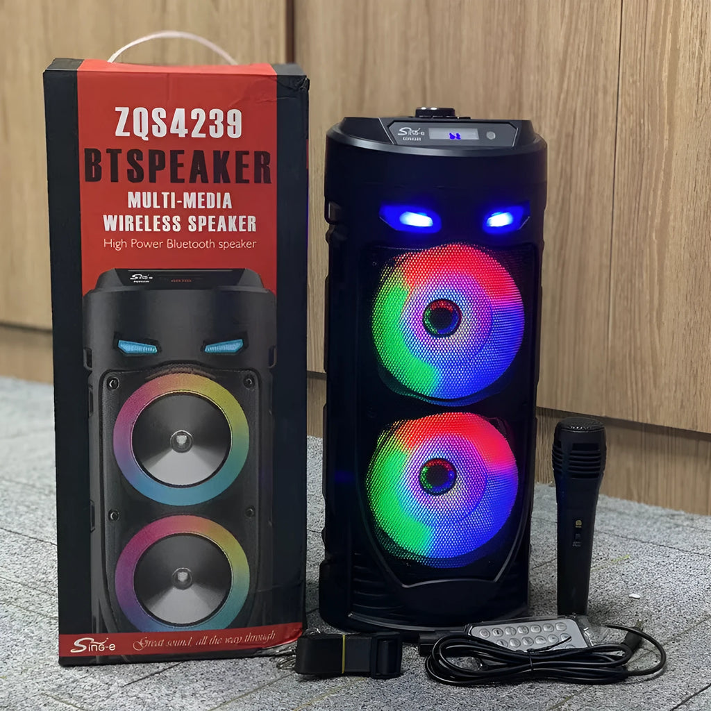 Black portable Bluetooth speaker with dual horn design and MP3 card slot on desktop