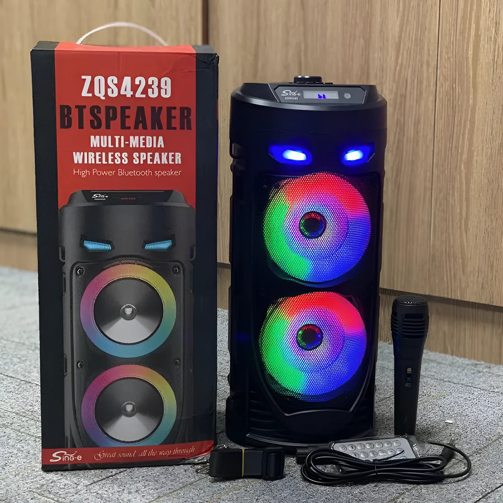 Black portable Bluetooth speaker with dual horn design and MP3 card slot on desktop