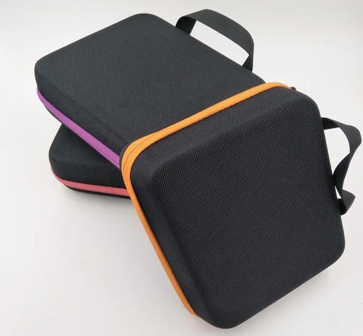 Red EVA essential oil storage bag with 30 compartments and a zipper, mounted on a wall.
