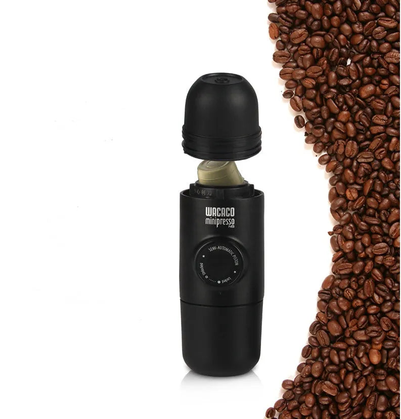 Black portable manual coffee machine showing compact size and manual operation components.