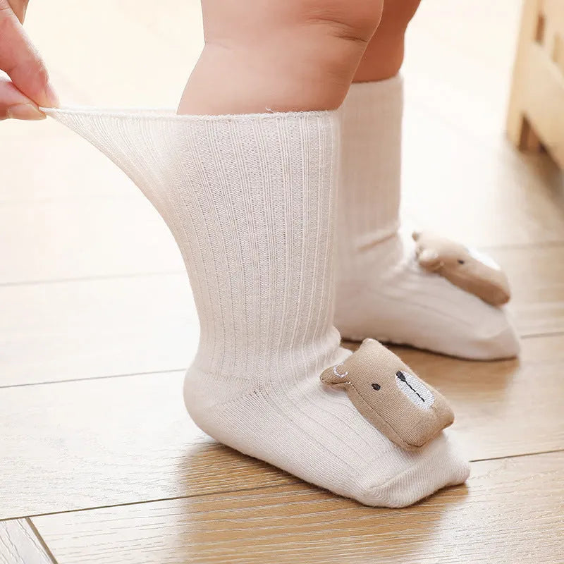 Children's combed cotton non-slip socks in multiple colours for sizes XS, S, and M.