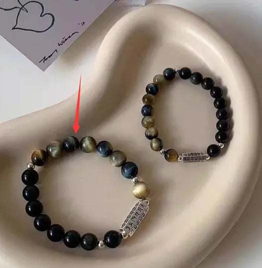 Sterling silver bracelet with obsidian and tigereye round beads featuring six words mantra Chinese design