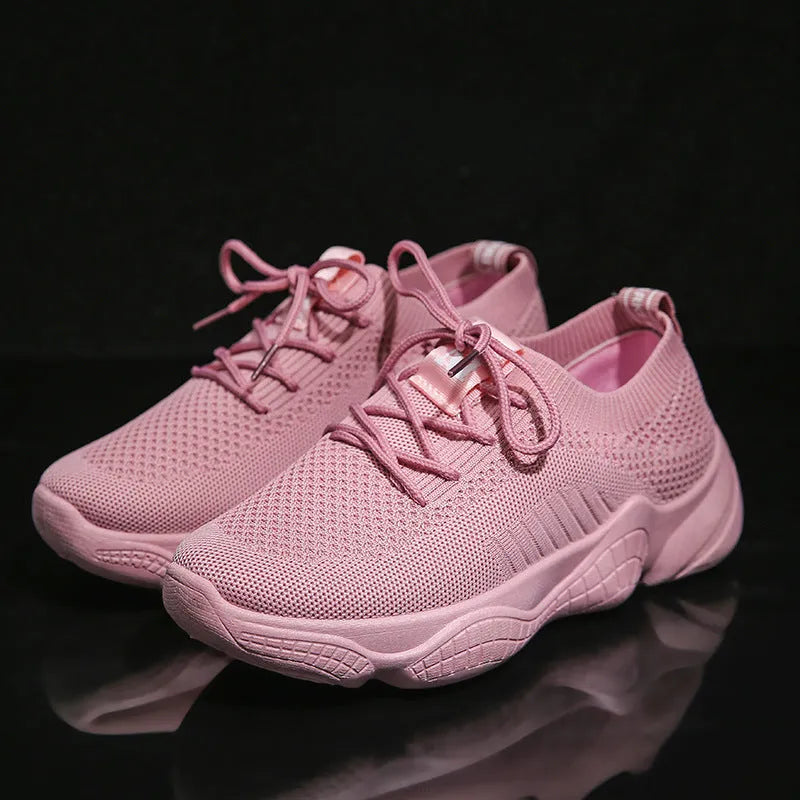 White thick-soled women's casual shoes with woven upper and front strap.