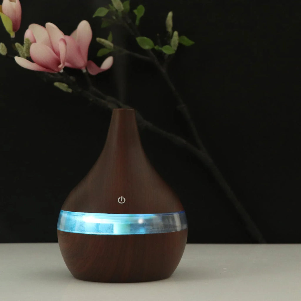 USB mini desktop air purifier and humidifier in wood grain finish for small rooms.