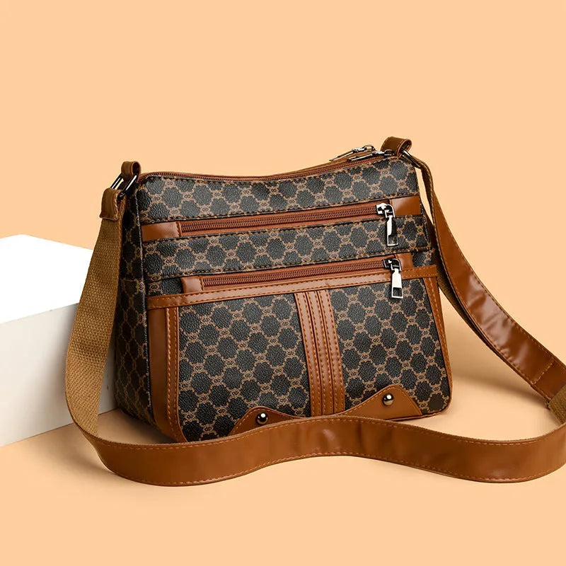 Brown women's crossbody bag with stitching pattern and adjustable shoulder strap.