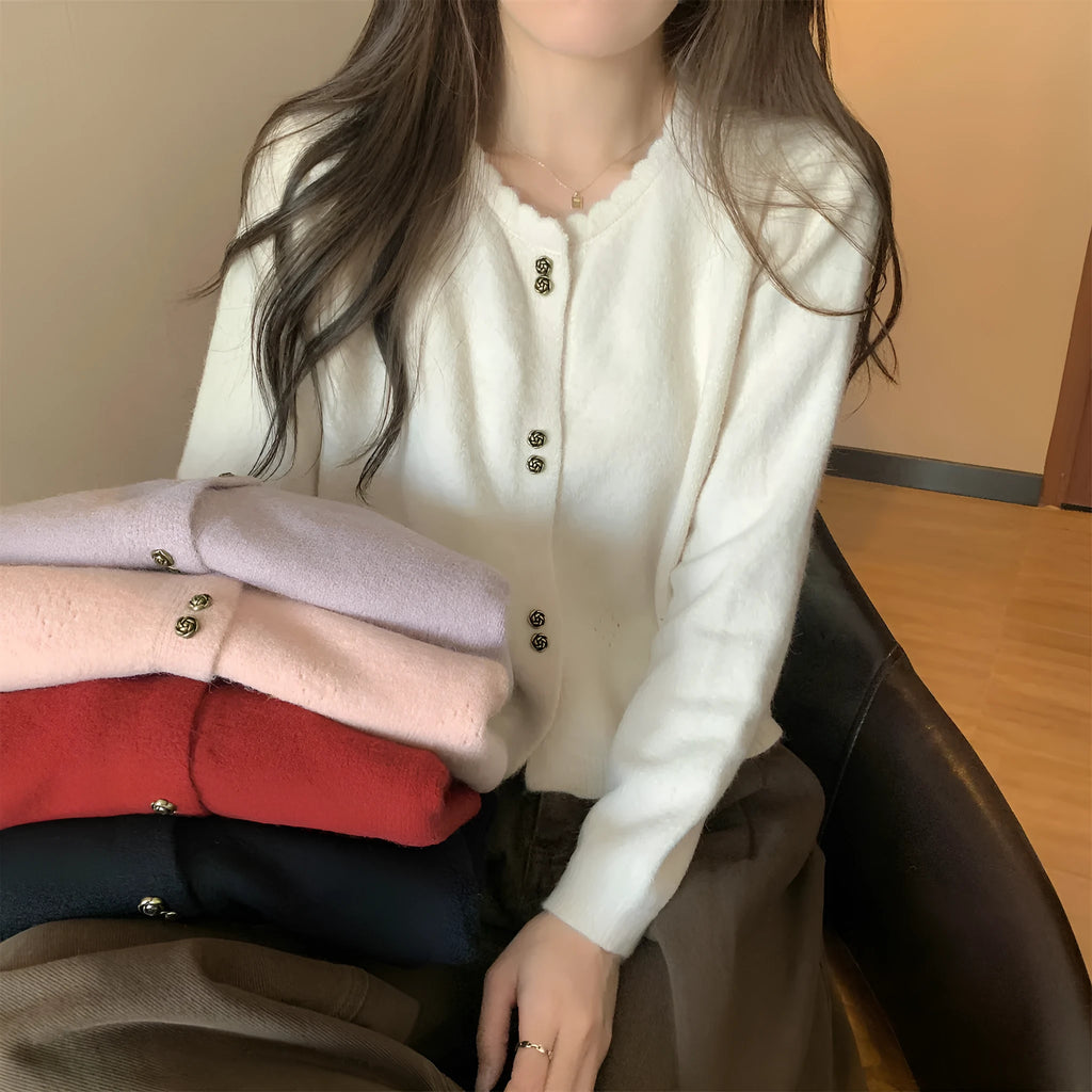Women's long-sleeved acrylic cardigan coat in multiple colours with regular sleeves.