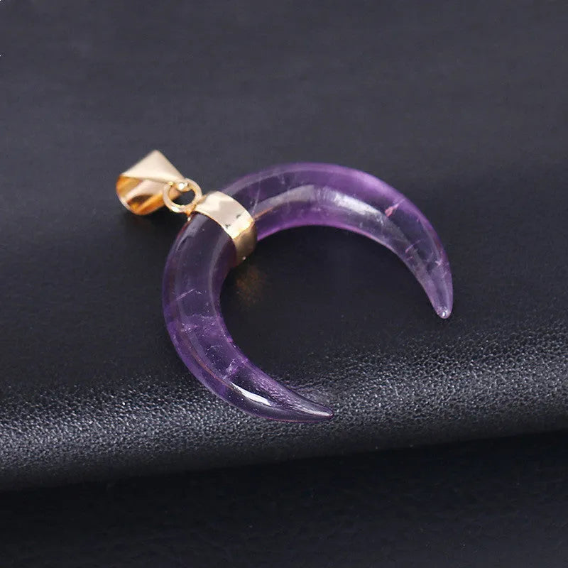 Natural crystal stone moon pendant necklace on an adjustable chain with copper fittings.