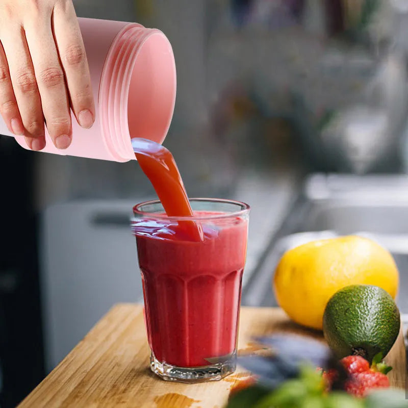 Blue portable blender with USB charging cable, shown folded and extended next to fruits.