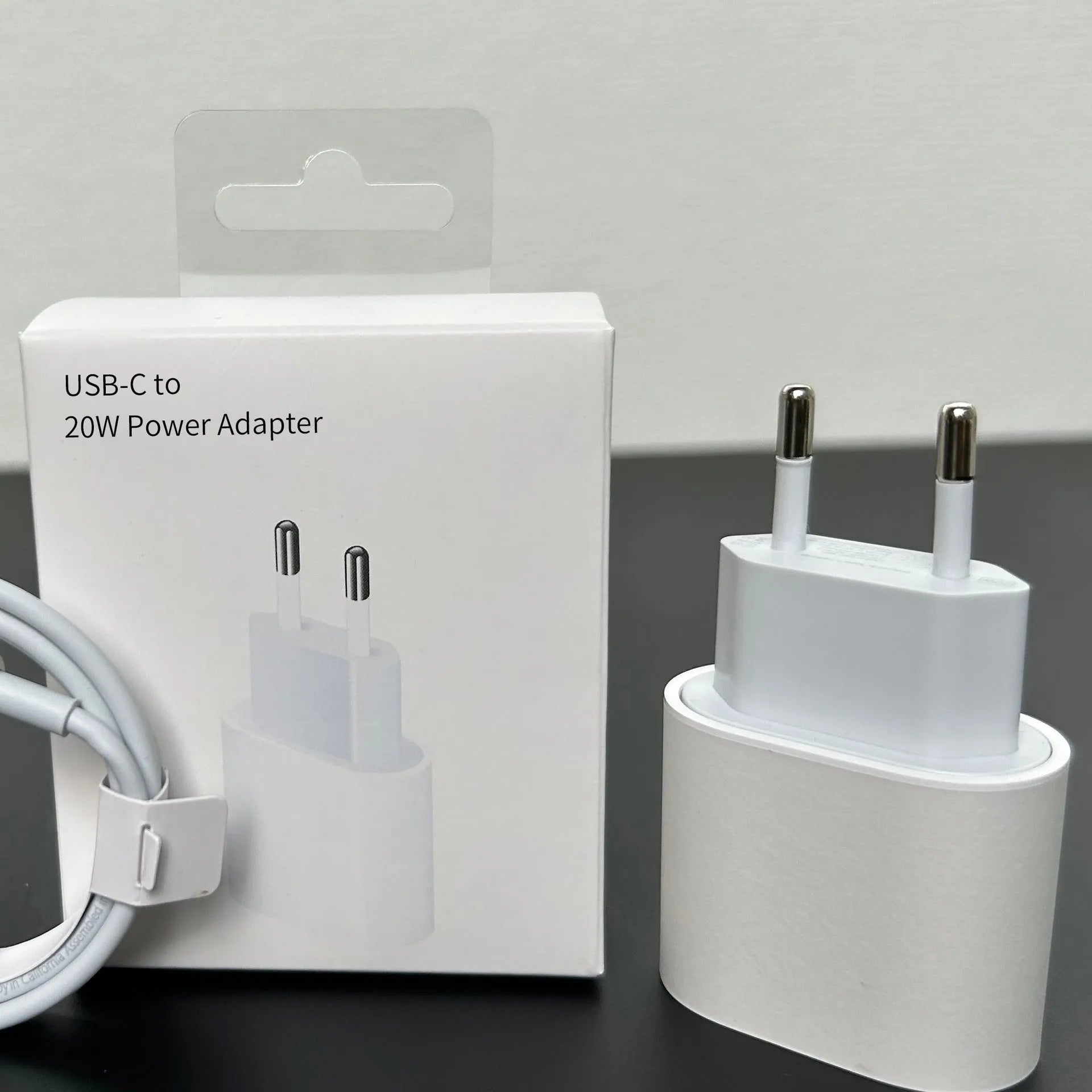 White 20W mobile PD charger with Type-C interface showing international plug compatibility