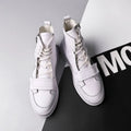 Men's black PU leather ankle boot in a high-top sneaker style for winter.