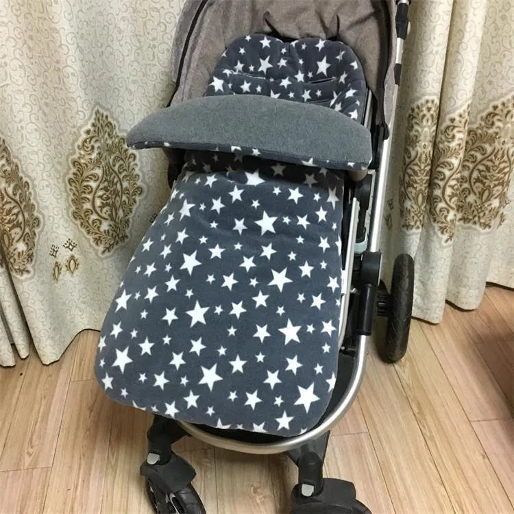 Envelope-style baby stroller sleeping bag in a plain colour, shown on a pram with lamb cashmere lining visible.