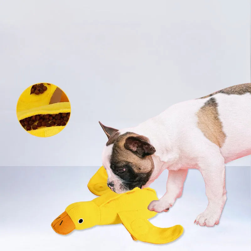 Yellow teddy duck dog toy with food leak openings for treat dispensing during training and play