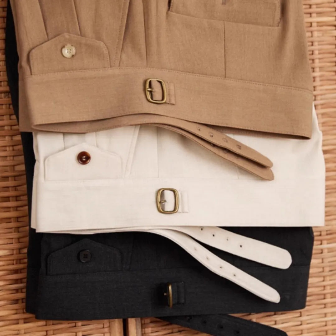Men's slim fit straight leg trousers in dark grey, light brown, and light apricot colours.