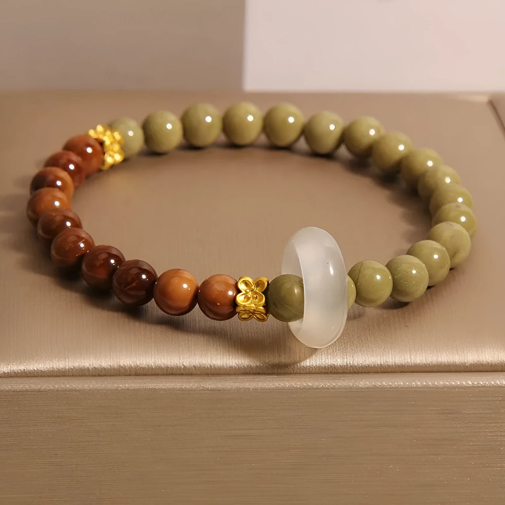 Green gradient Chinese style bracelet with crown and diamond motifs on mixed materials