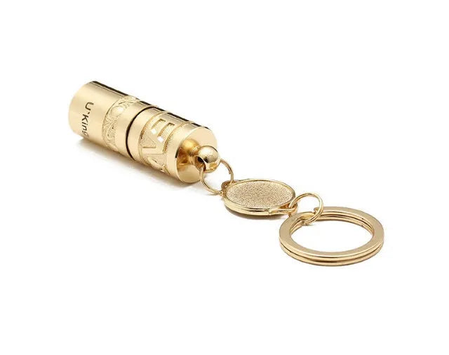 Gold-finish zinc alloy waterproof LED keychain torch with compact design for portable emergency lighting