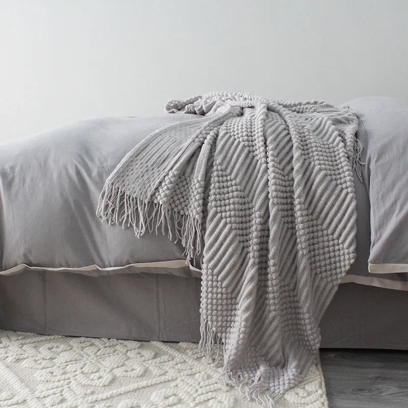 Soft grey polyester baby blanket laid flat, showing 127x170cm size for crib or pram naps.