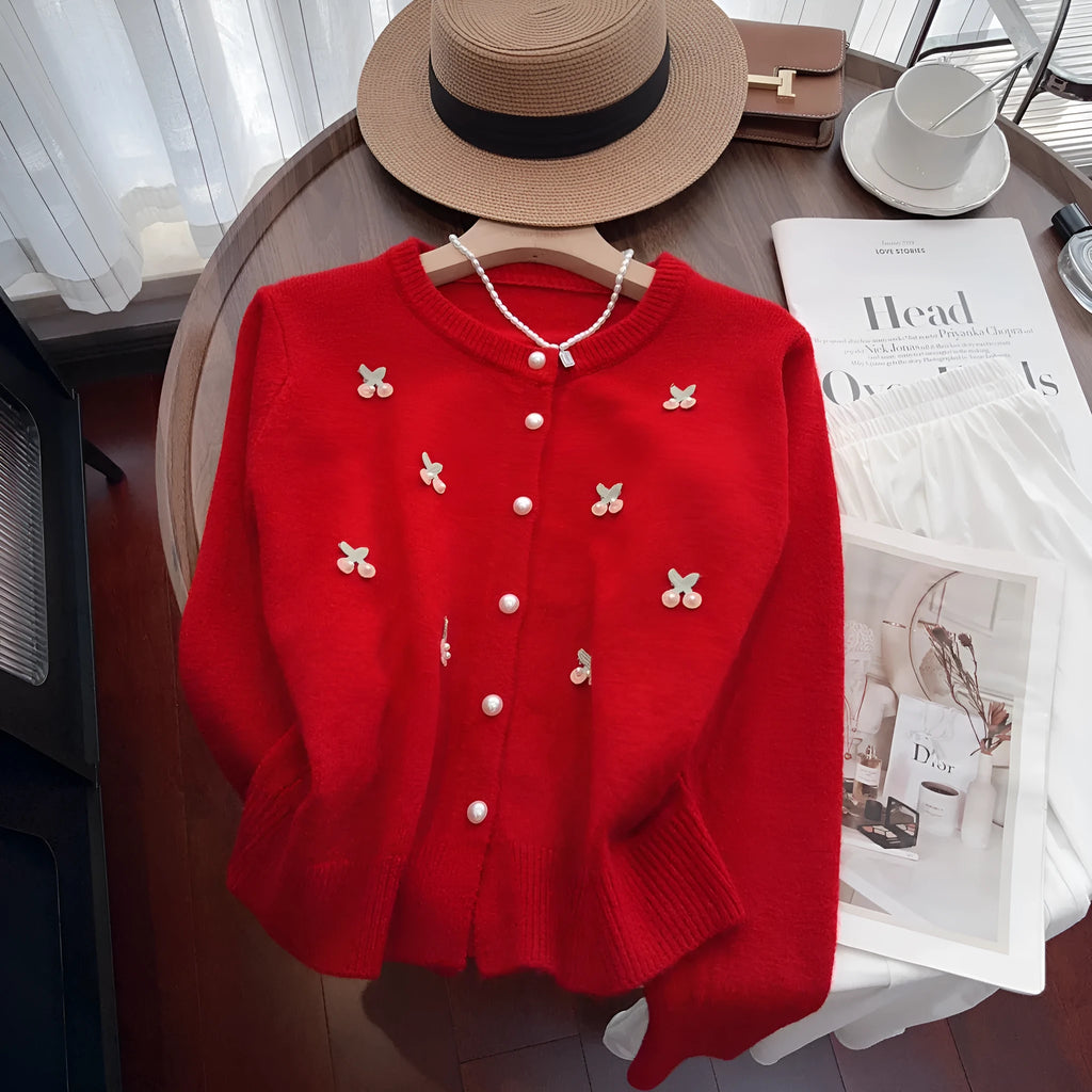 Women's pink cashmere cardigan sweater coat with bead detailing, round neck, and slim fit.
