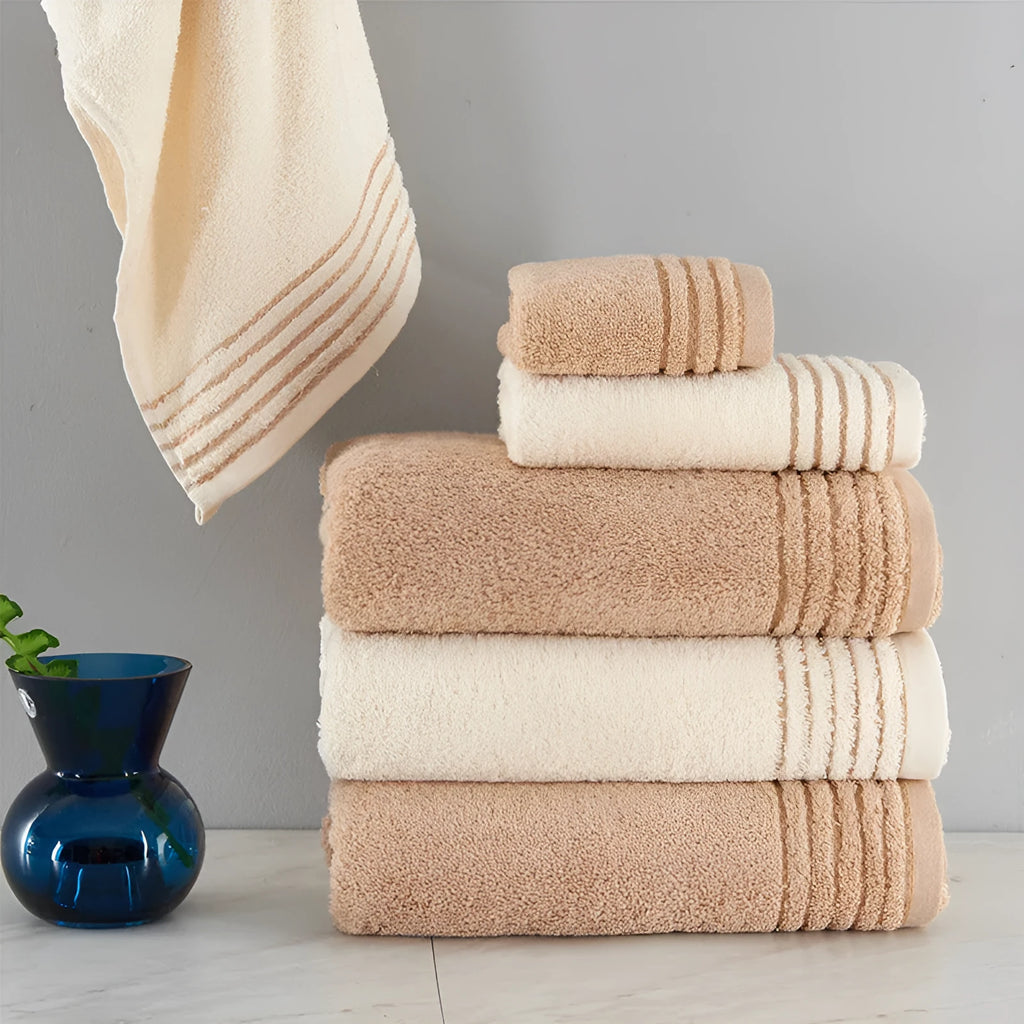Cotton towel set showing bath, hand and face towels in beige or brown colours